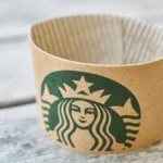 Papacko eco coffee accessories showcasing biodegradable stirrers, compostable sleeves, and sustainable packaging for environmentally conscious cafés