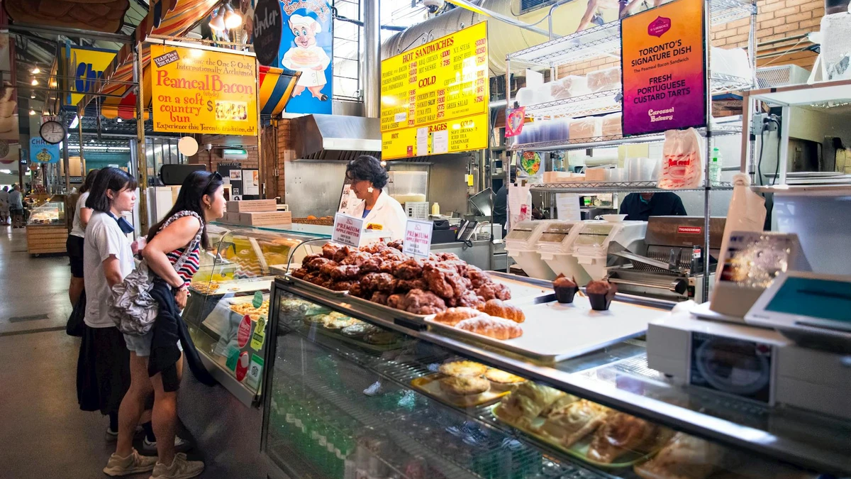 Papacko busy street food market with vendors serving food in kraft paper boxes to customers
