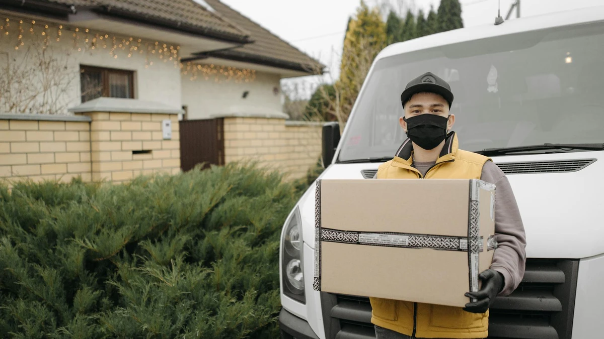 Papacko delivery driver carrying <a href=