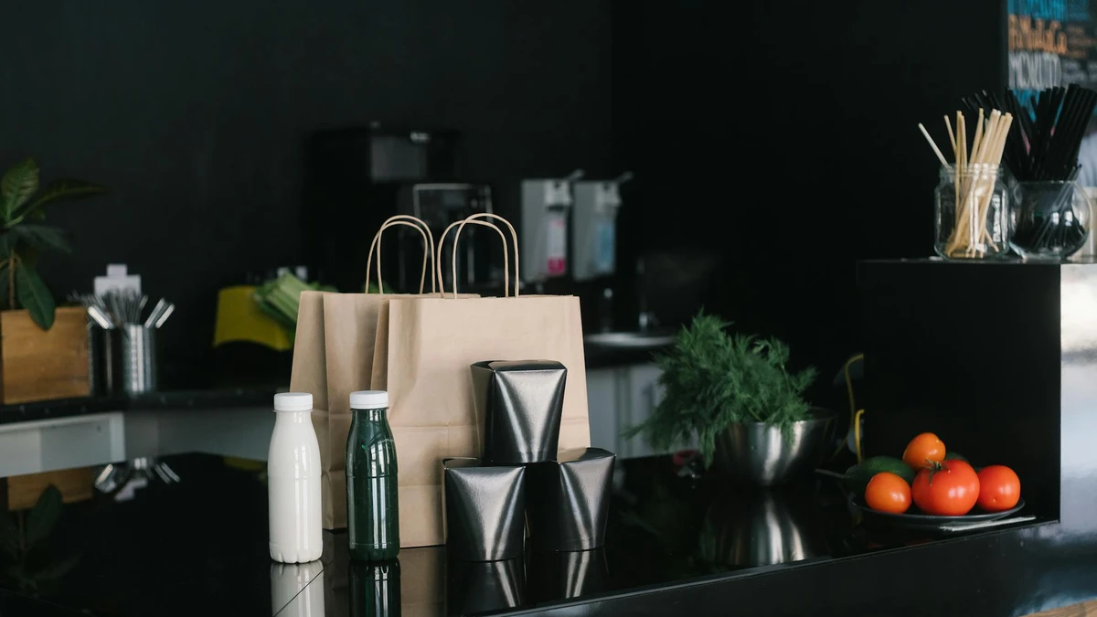 Papacko eco café interior with recycled paper accessories and sustainable packaging on counter