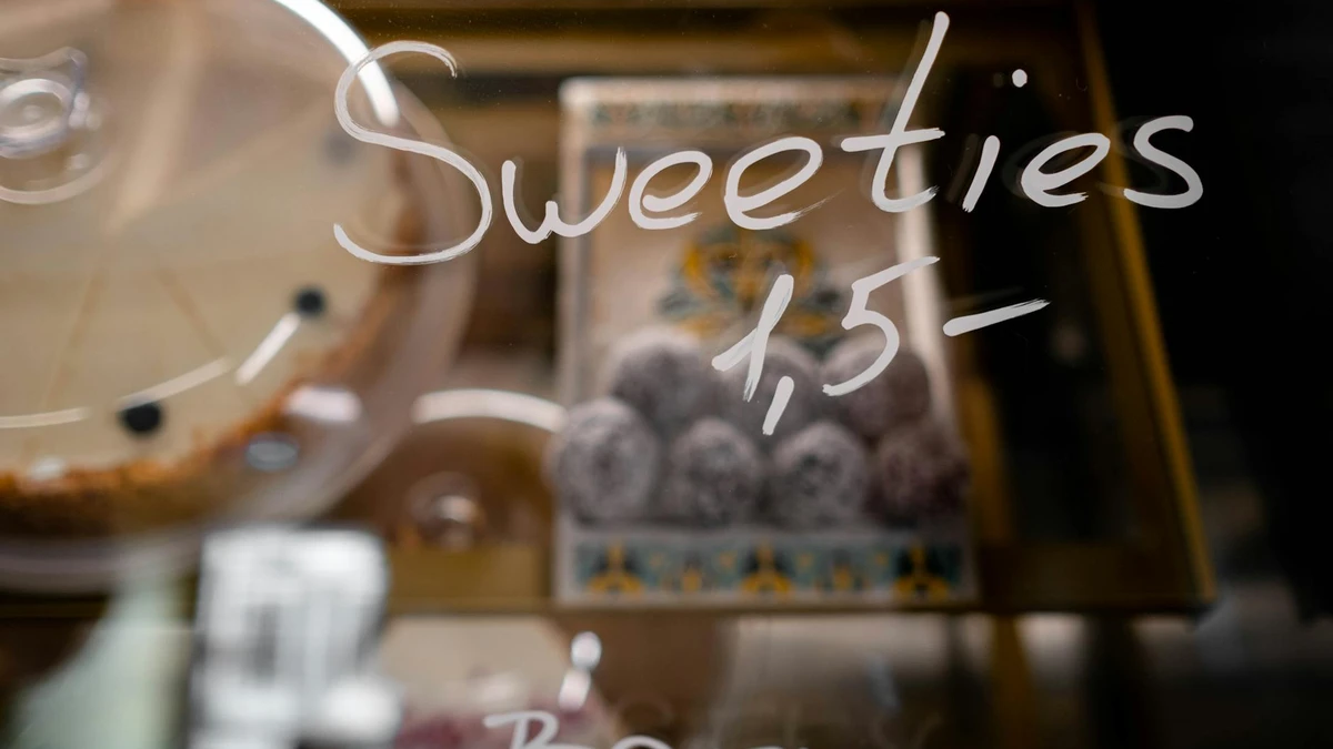 Papacko Bakery display case showcasing assorted pastries and desserts in transparent windowed paper boxes wi