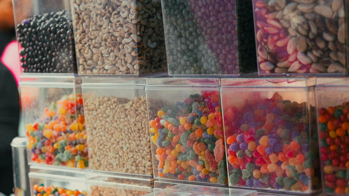 Papacko Health food café display case with colorful salads in window-lid containers, customers selecting mea
