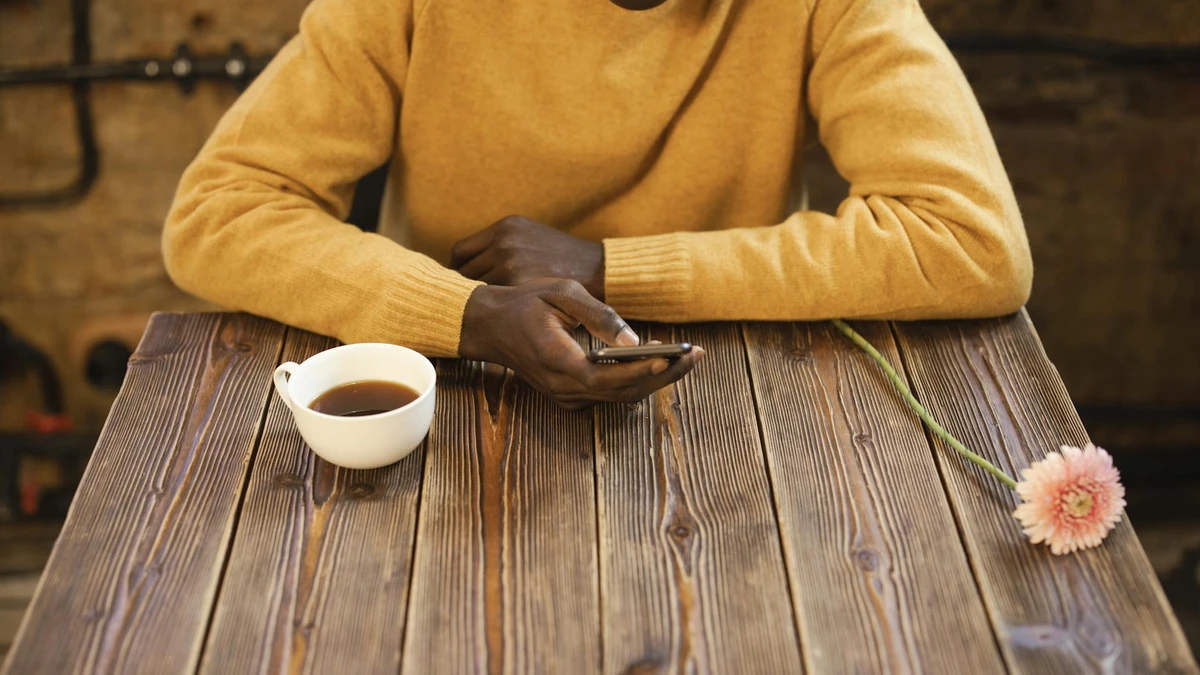 Papacko Eco-friendly café interior with customers using compostable coffee accessories, recycling/composting