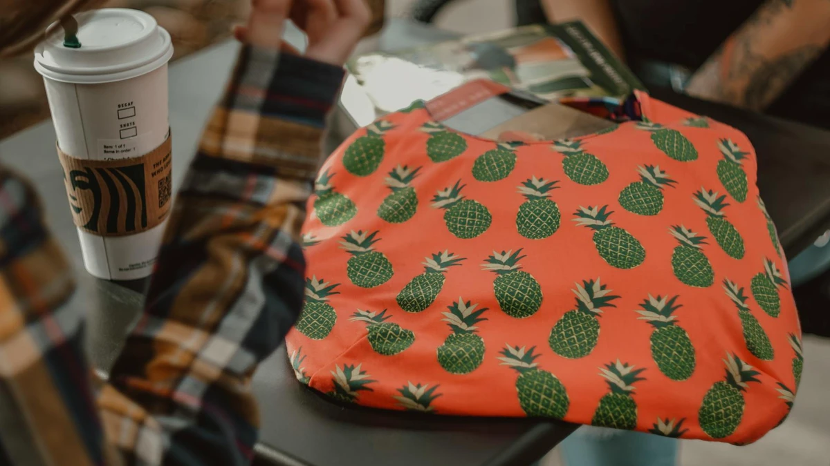 Papacko close-up of custom branded coffee cups with detailed printed designs and logos