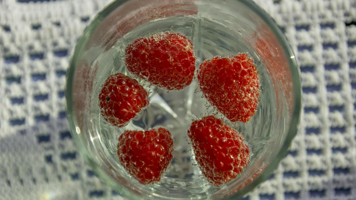 Papacko close-up of transparent cups filled with bubble tea showing tapioca pearls and fruit toppings throug