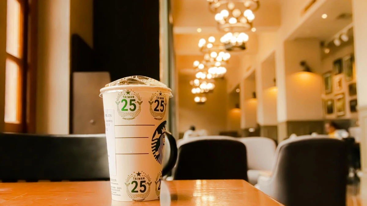 Papacko Branded ripple wall coffee cups on café counter with visible logo and texture, barista preparing dri