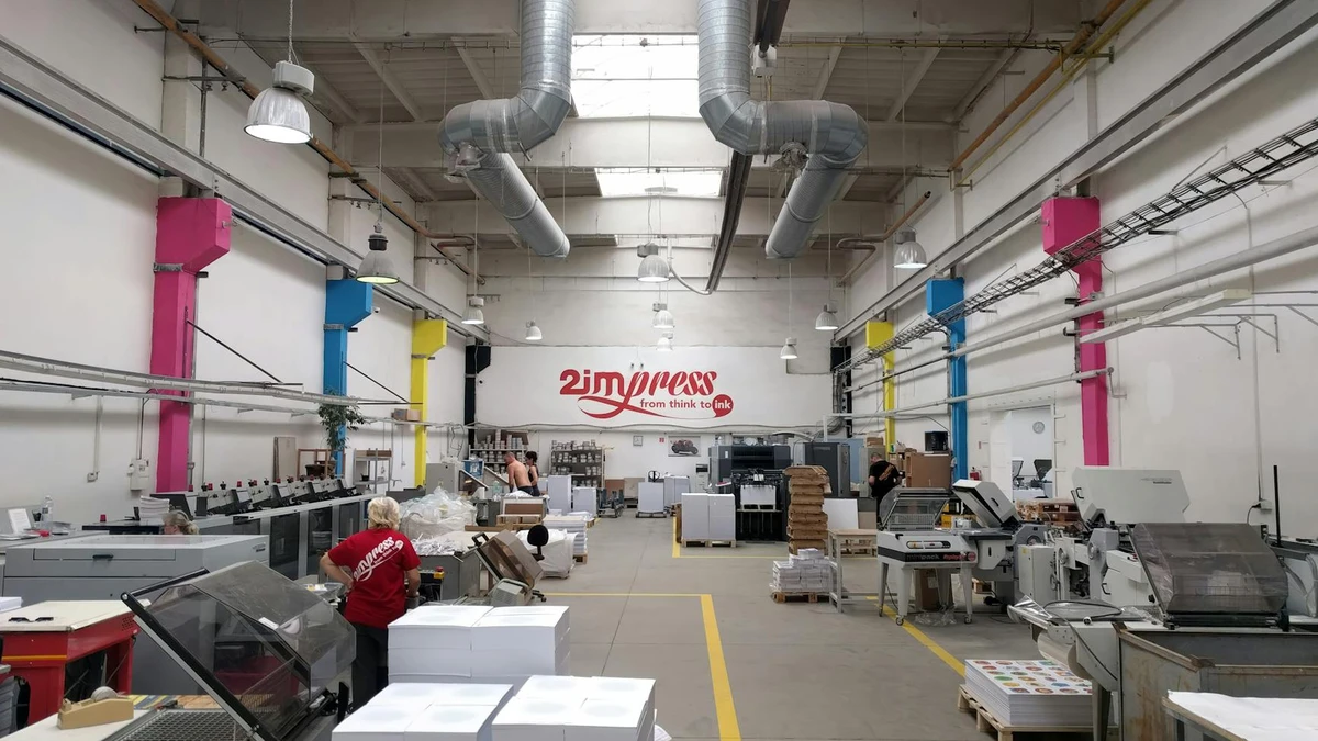 Papacko Manufacturing facility showing automated paper cup production line with quality control, representin