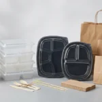 Meal prep containers, lids, bowls, and bags arranged for restaurant takeaway packaging