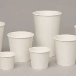 Empty unbranded paper takeaway cups arranged for artwork template review