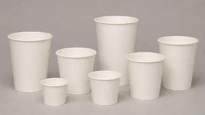 Empty unbranded paper takeaway cups arranged for artwork template review