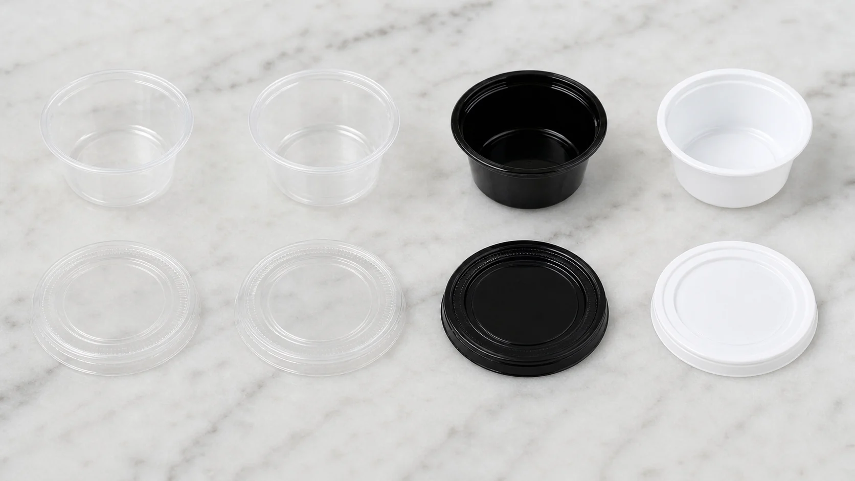 Empty condiment cups and plain lids arranged for fit review