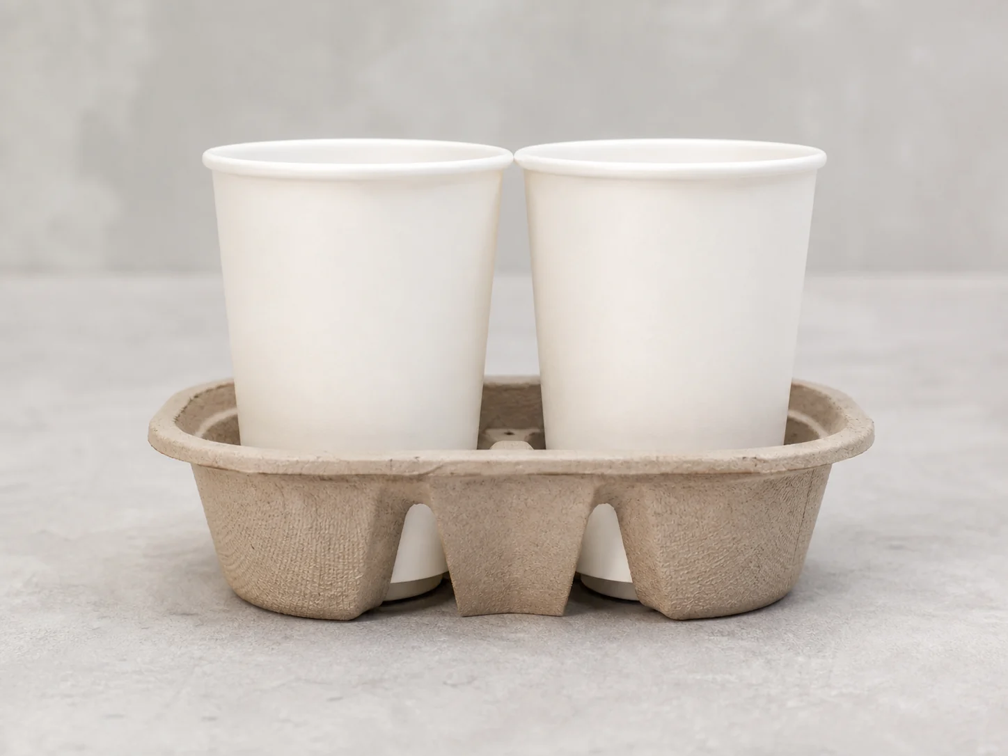 Unbranded paper cups seated in a molded drink carrier for fit review