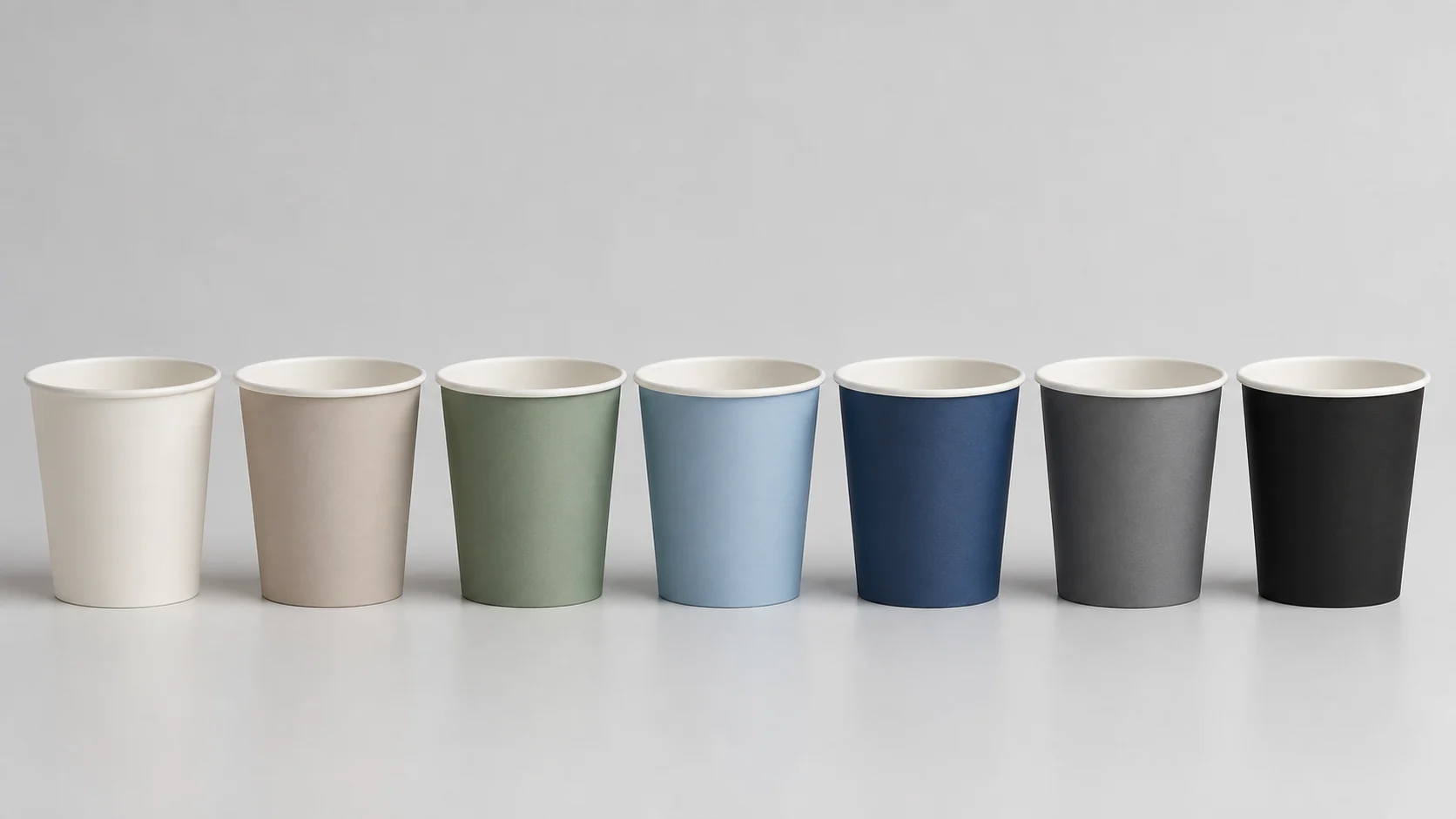 Empty unbranded paper cups with simple neutral colour blocks for proof review