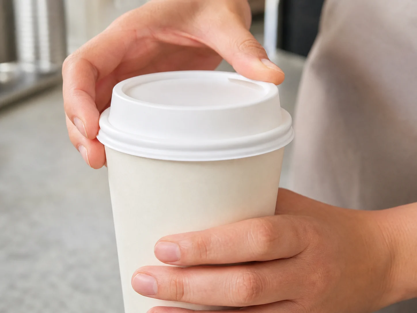 Unbranded disposable coffee cup and lid samples prepared for rim-fit testing