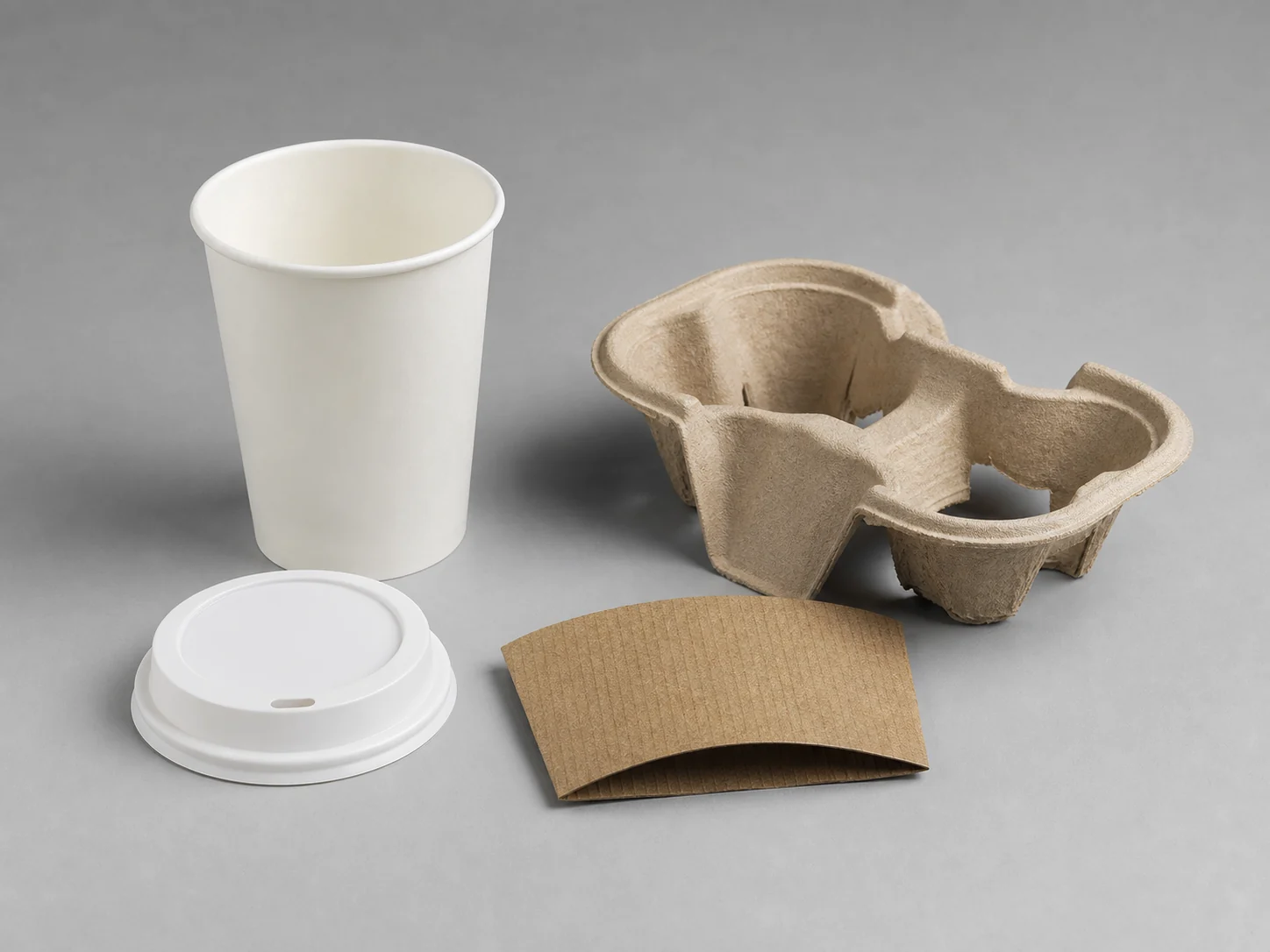 Paper cup lid sleeve and carrier shown as separate foodservice components