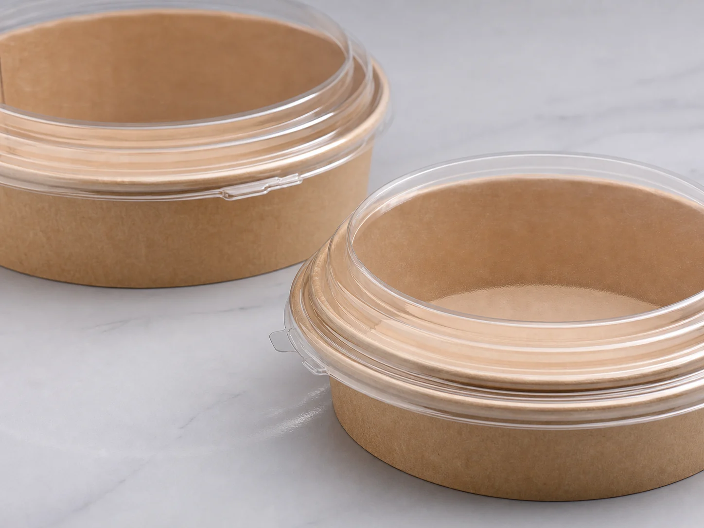 Unbranded salad container and lid samples prepared for fit review.
